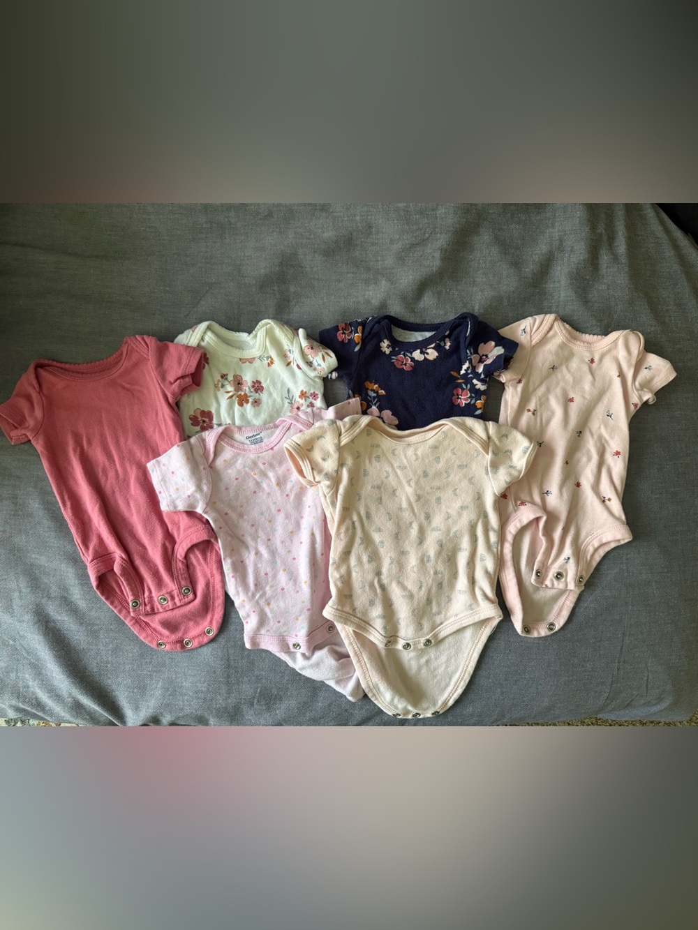 Bundle of Six Girls’ Short-Sleeved Newborn Onesies